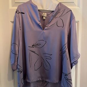 Short sleeved Purple top with delicate black flowers. Size XL